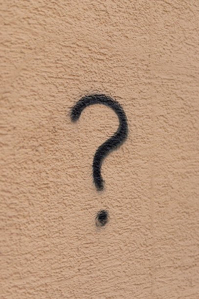 question mark sprayed on wall