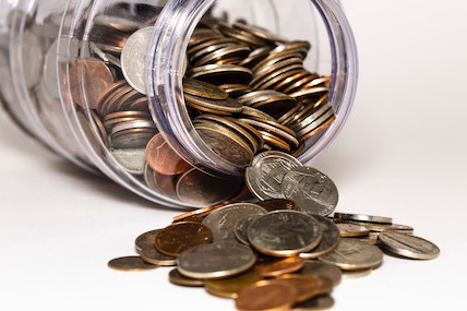money pouring out of jar